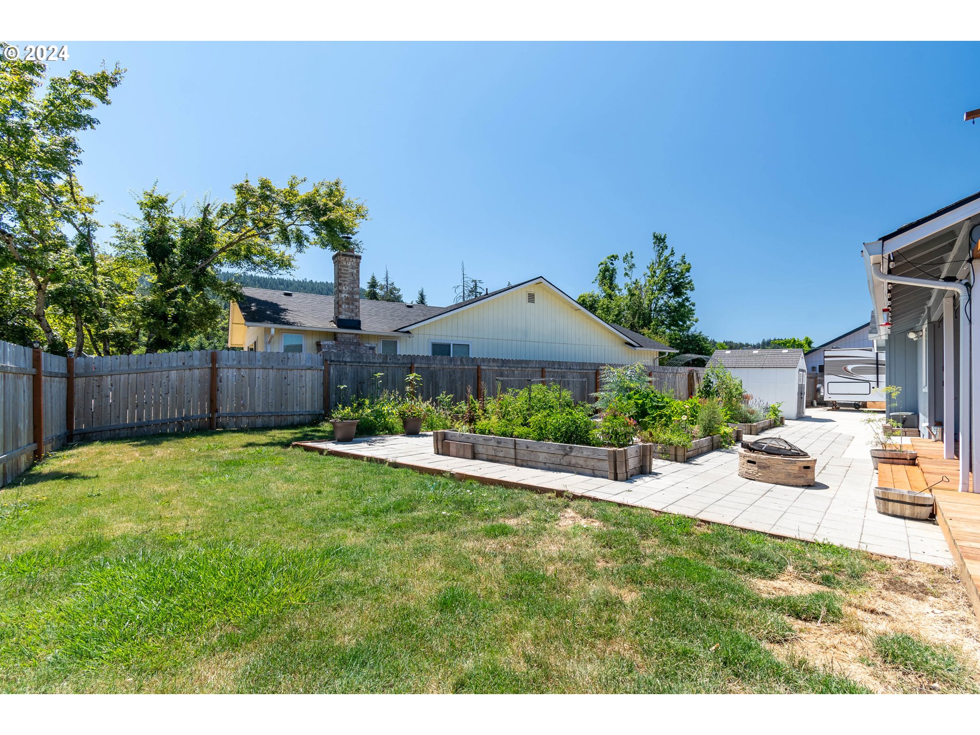 7345 B Street Springfield, OR 97478 - Photo 34 of 48 a view of a house with a yard and sitting area