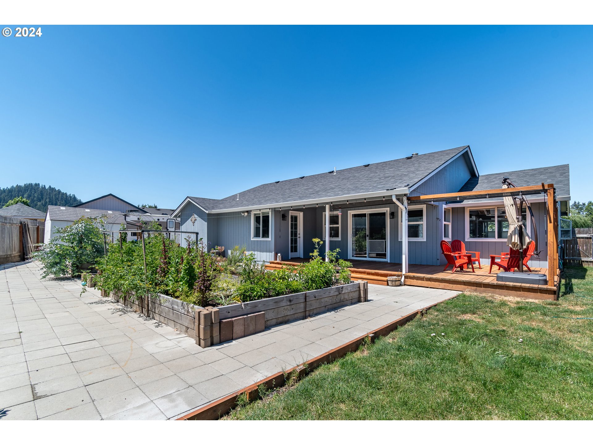 7345 B Street Springfield, OR 97478 - Photo 36 of 48 a view of a house with garden and plants