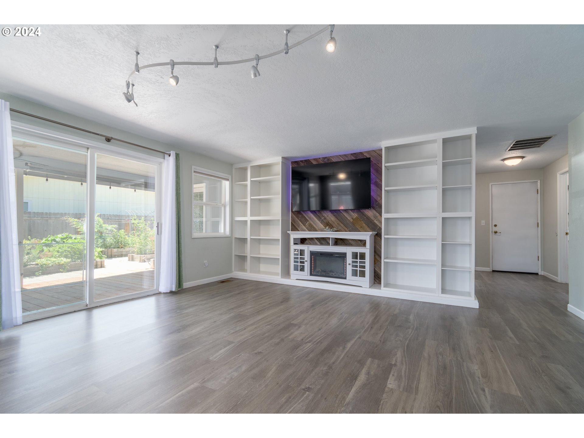 7345 B Street Springfield, OR 97478 - Photo 4 of 48 a view of a room with wooden floor and a window