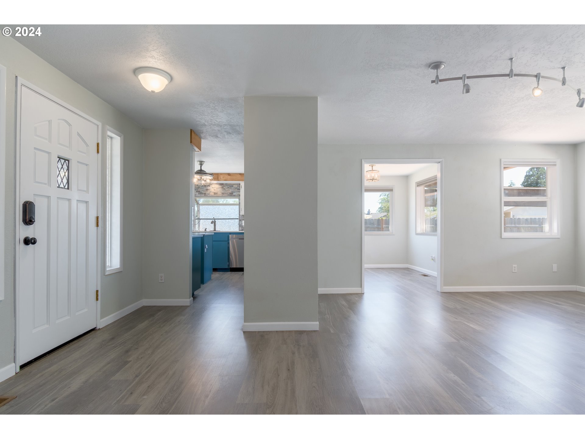 7345 B Street Springfield, OR 97478 - Photo 7 of 48 a view interior of a house with wooden floor and windows