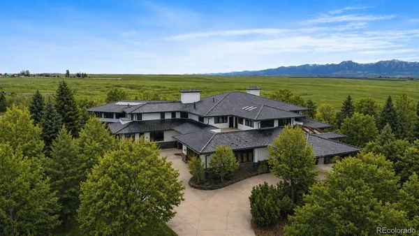 an aerial view of a house with a garden