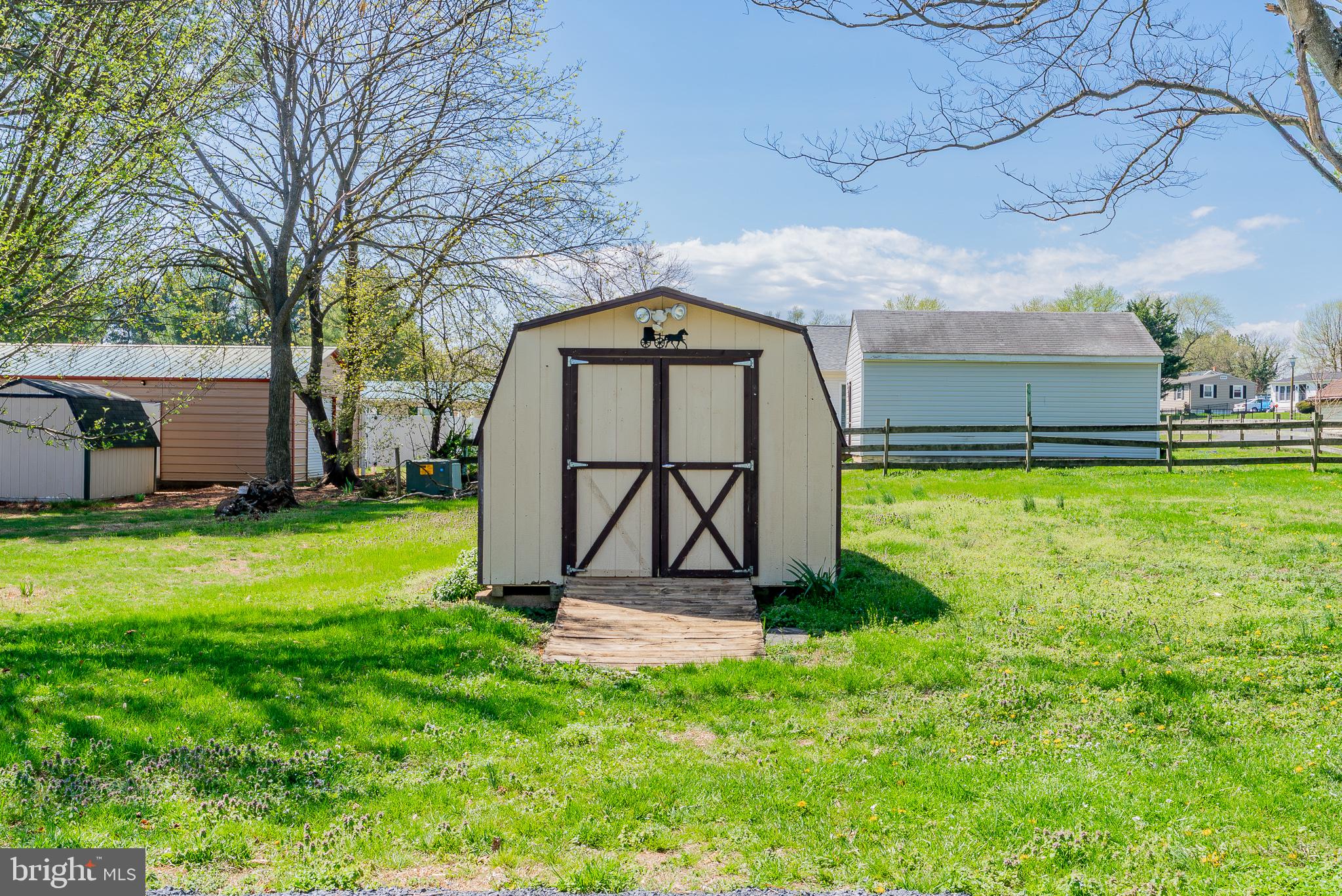 329 Dutch Mount Mount Jackson, VA 22842 - Photo 37 of 50 Charming shed in a lush green yard.