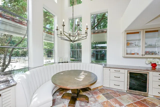 a kitchen with a table and chairs in it
