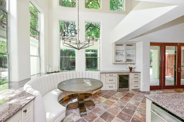 a dining room with furniture a livingroom view and wooden floor