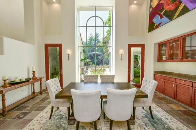a view of a dining room with furniture wooden floor and a rug