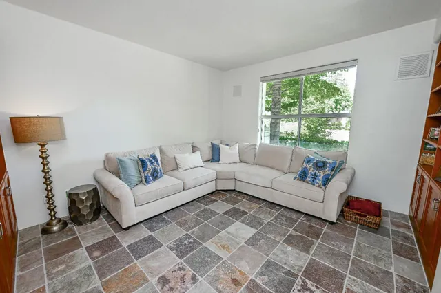 a living room with furniture and a window