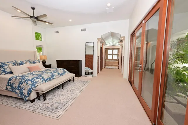 a bathroom with a granite countertop sink a mirror and shower