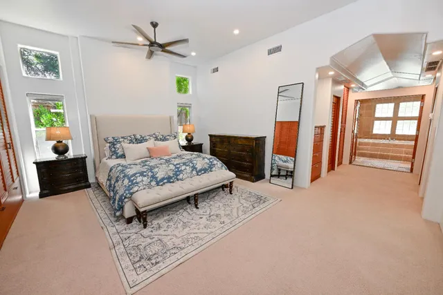 a spacious bathroom with a tub and a shower
