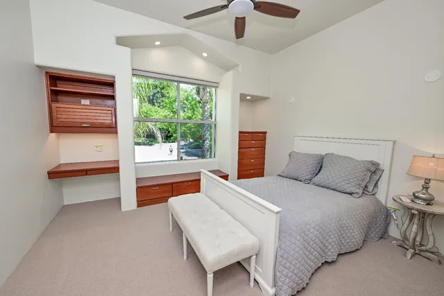 a kitchen with stainless steel appliances cabinets and window