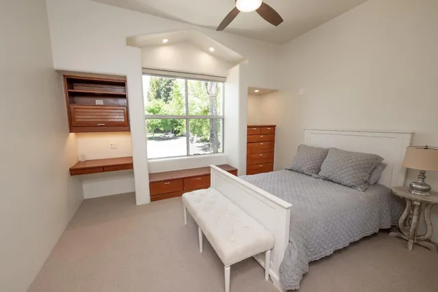 a view of a house with backyard porch and sitting area