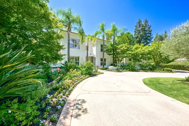 a house with a tree in front of it