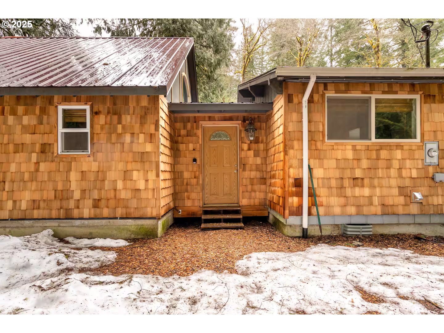 71010 Mc Farland Road Rhododendron, OR 97049 - Photo 3 of 34 a front view of a house with a yard