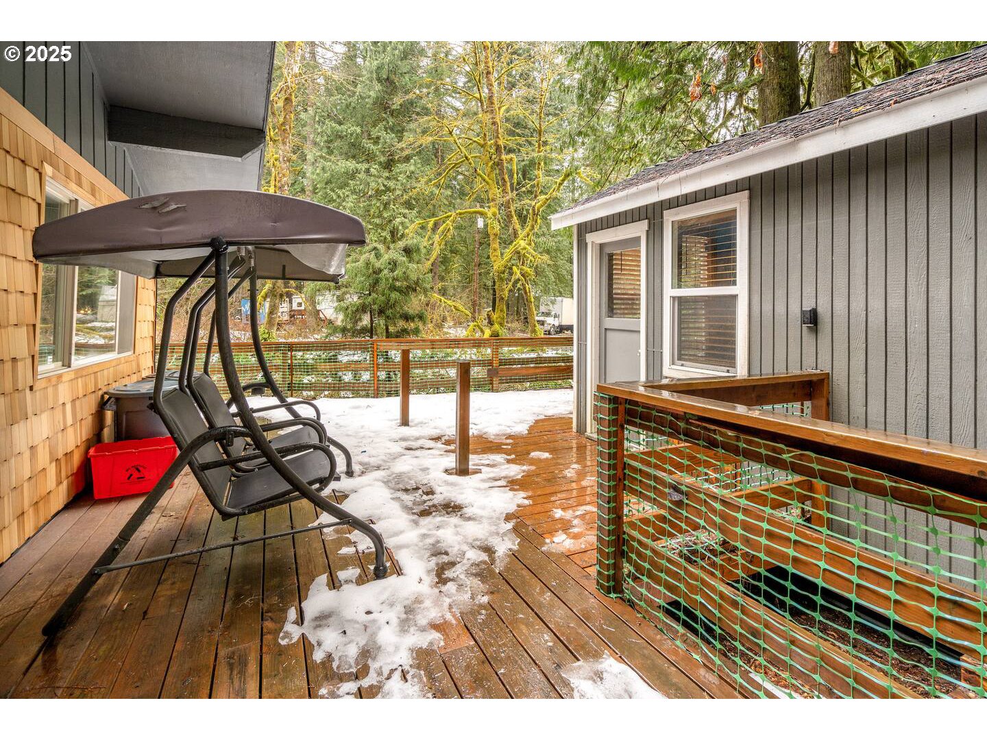71010 Mc Farland Road Rhododendron, OR 97049 - Photo 31 of 34 a view of a patio with a table and chairs under an umbrella