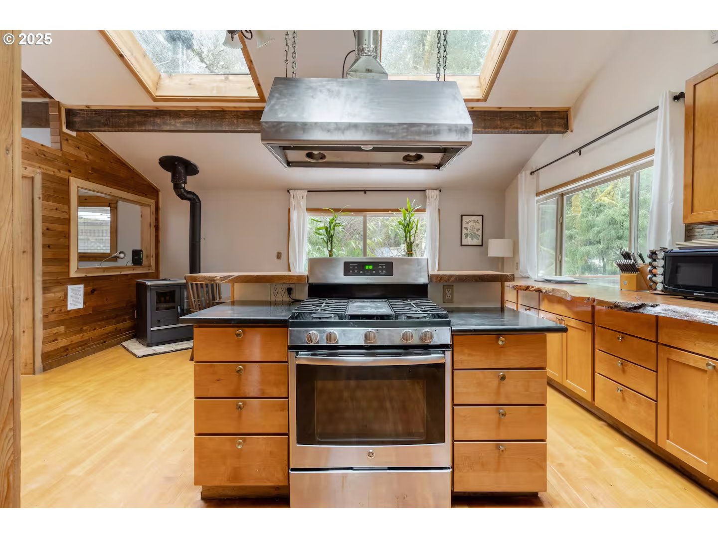71010 Mc Farland Road Rhododendron, OR 97049 - Photo 8 of 34 a kitchen with stainless steel appliances granite countertop a stove a sink and a refrigerator