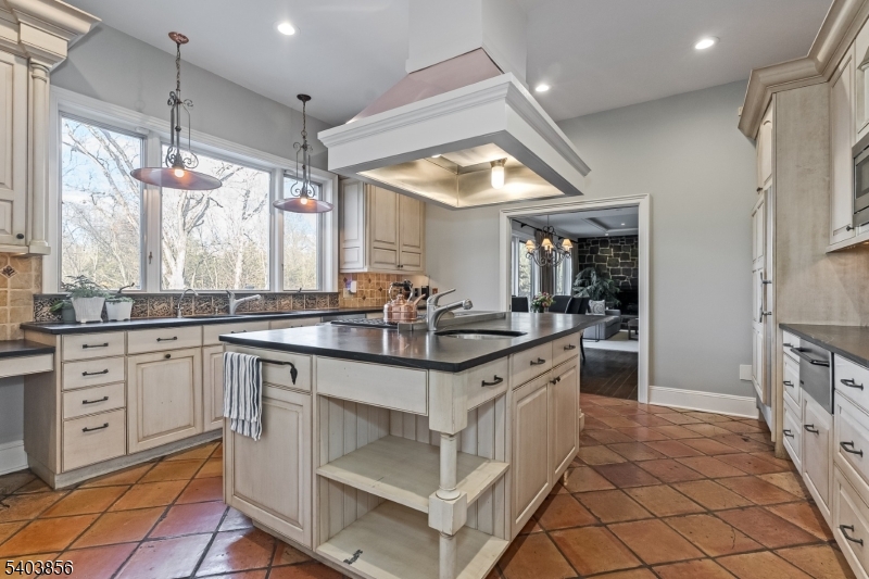 101 Sunny Branch Road Far Hills, NJ 07931 - Photo 14 of 35 a kitchen with stainless steel appliances granite countertop a sink and a stove