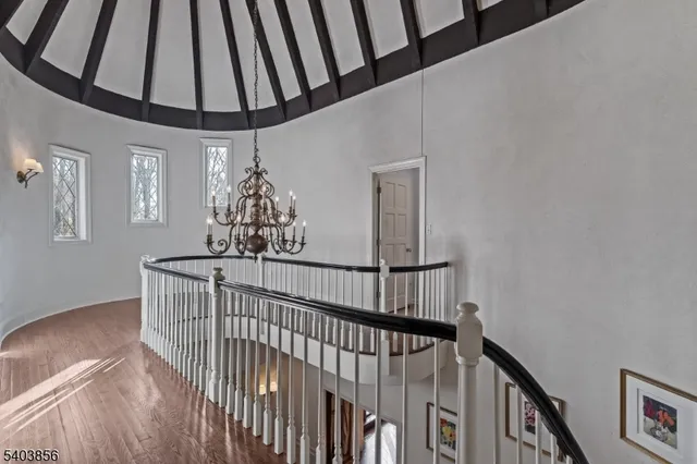 a bedroom with a bed and chair