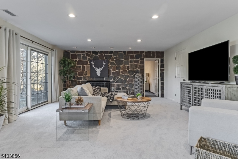 101 Sunny Branch Road Far Hills, NJ 07931 - Photo 25 of 35 a living room with furniture and a flat screen tv