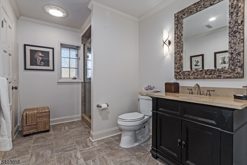 101 Sunny Branch Road Far Hills, NJ 07931 - Photo 28 of 35 a bathroom with a sink toilet and a mirror