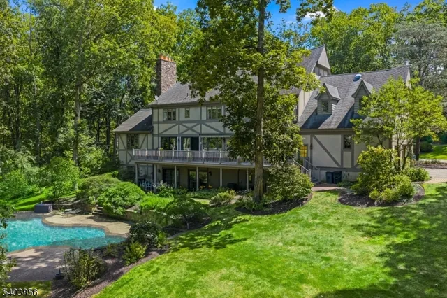 a view of a garden with a house in the background