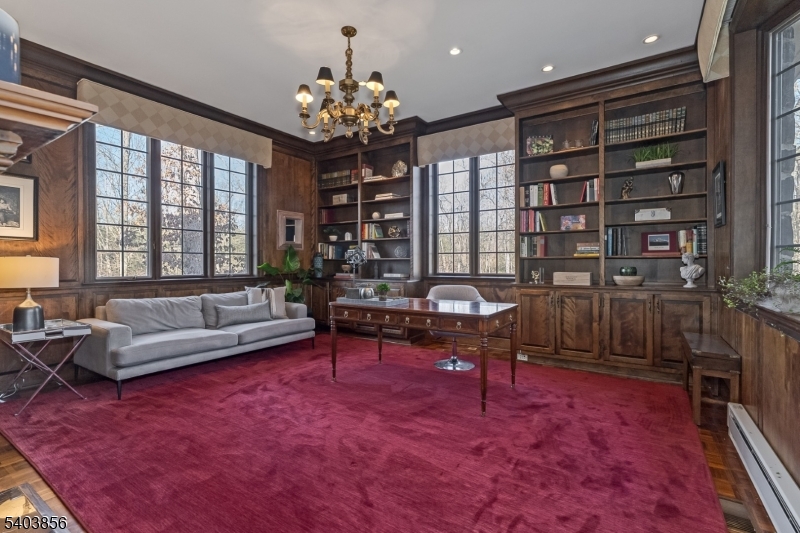 101 Sunny Branch Road Far Hills, NJ 07931 - Photo 10 of 35 a living room with furniture a chandelier and a rug