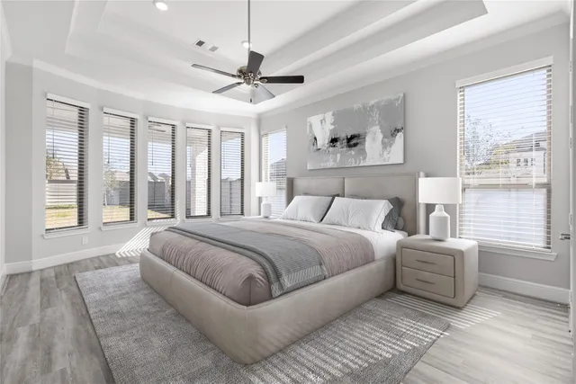 a bedroom with a large bed and a window