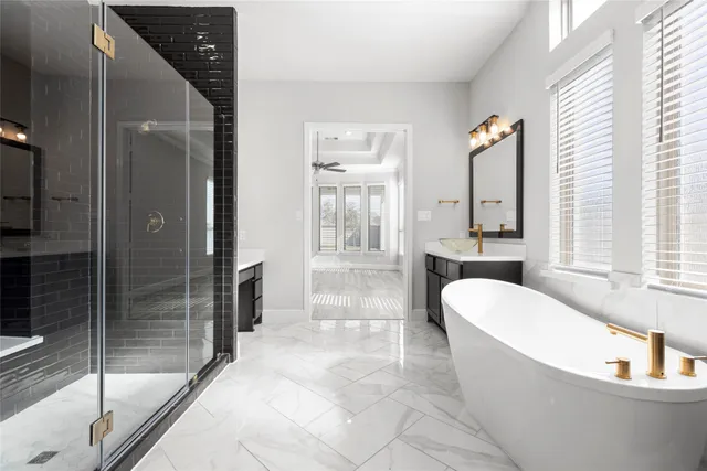 a spacious bathroom with a bathtub and a shower
