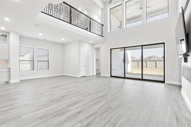 a view of an entryway with wooden floor
