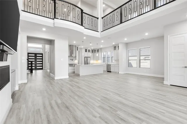 a view of an entryway with wooden floor