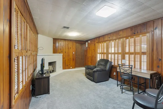 a dining room with furniture and chandelier