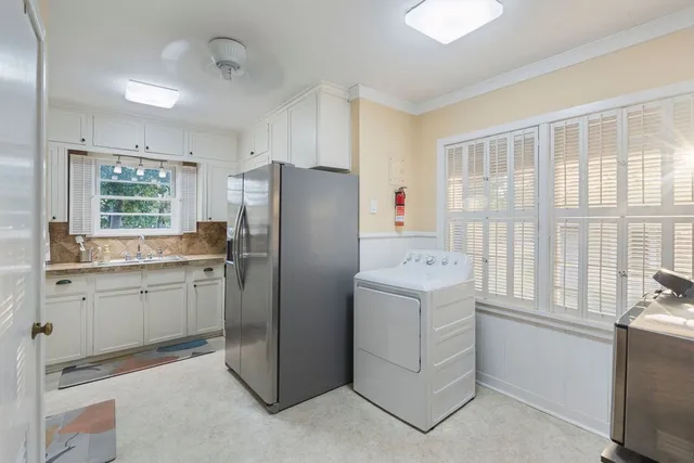 a kitchen with a sink stove and refrigerator