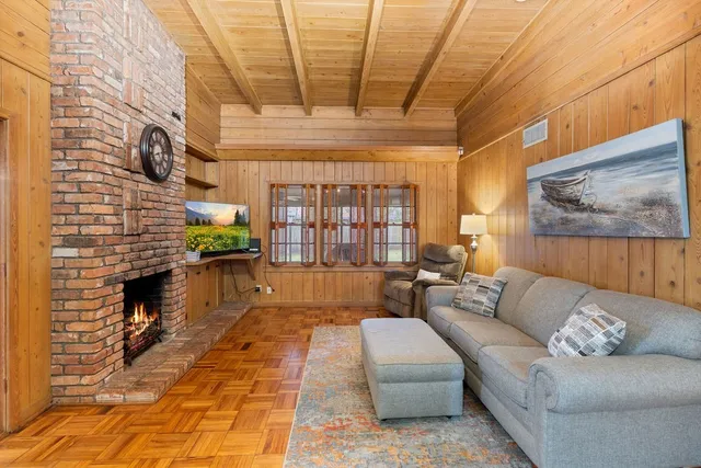 a view of a dining room with furniture and a window
