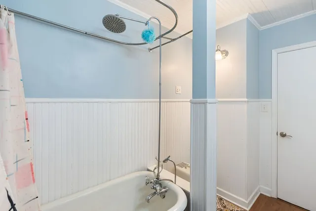 a bedroom with a bed closet and a window