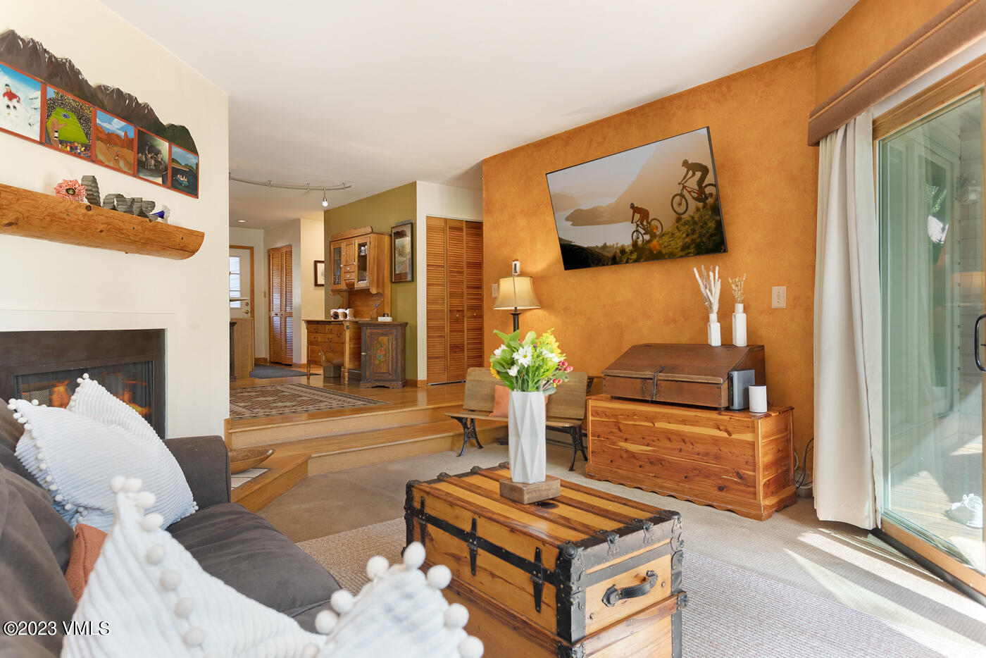 945 Red Sandstone Road, Unit B3 Vail, CO 81657 - Photo 11 of 48 a living room with furniture and a fireplace