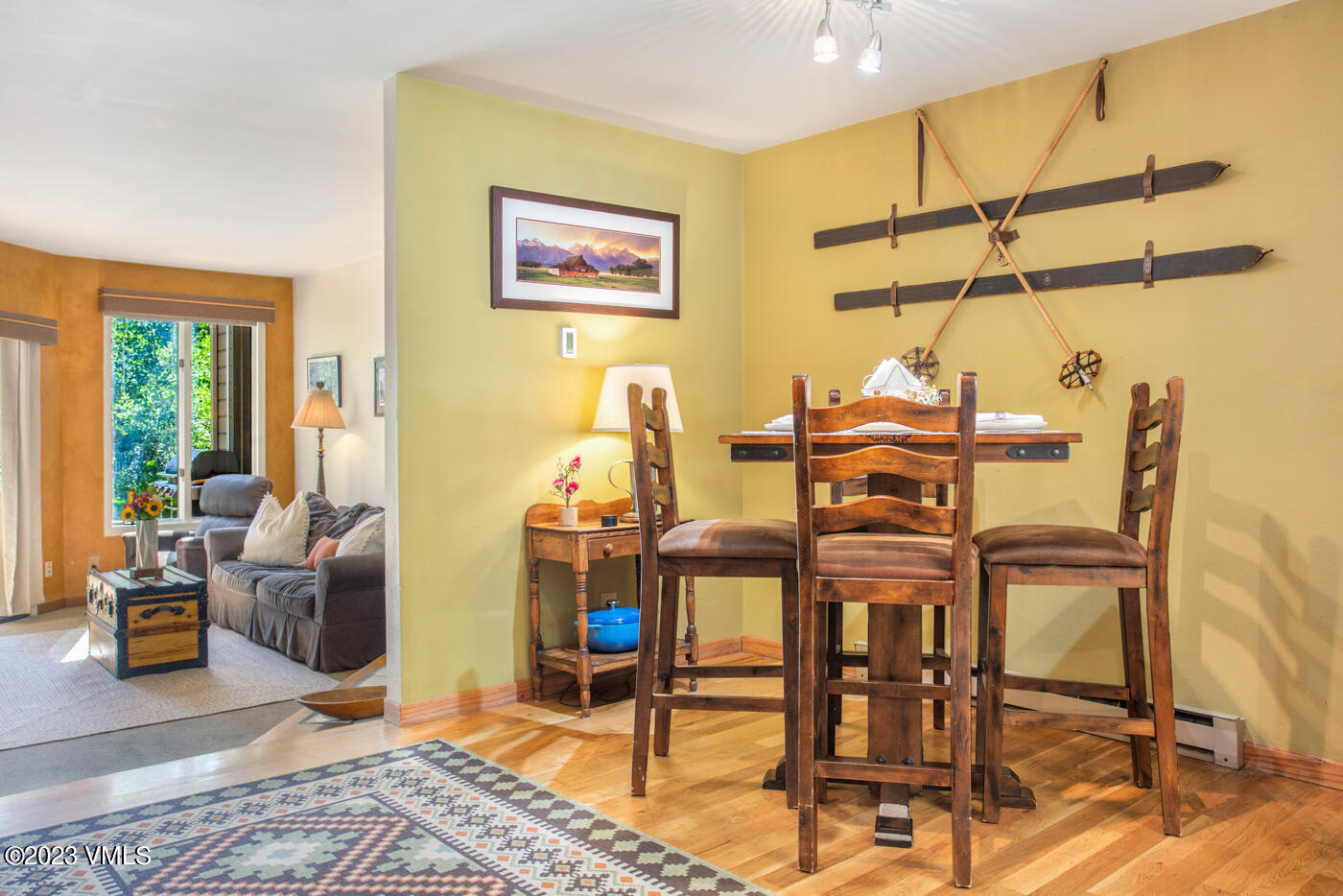 945 Red Sandstone Road, Unit B3 Vail, CO 81657 - Photo 12 of 48 a dining room with furniture and wooden floor
