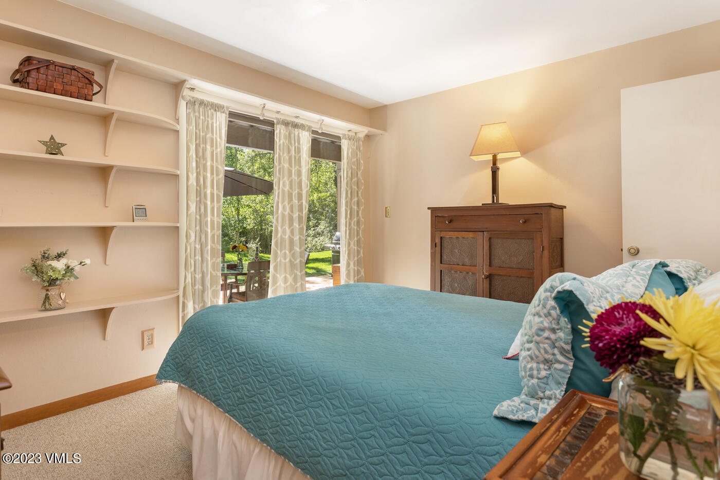 945 Red Sandstone Road, Unit B3 Vail, CO 81657 - Photo 21 of 48 a bedroom with a bed and a window