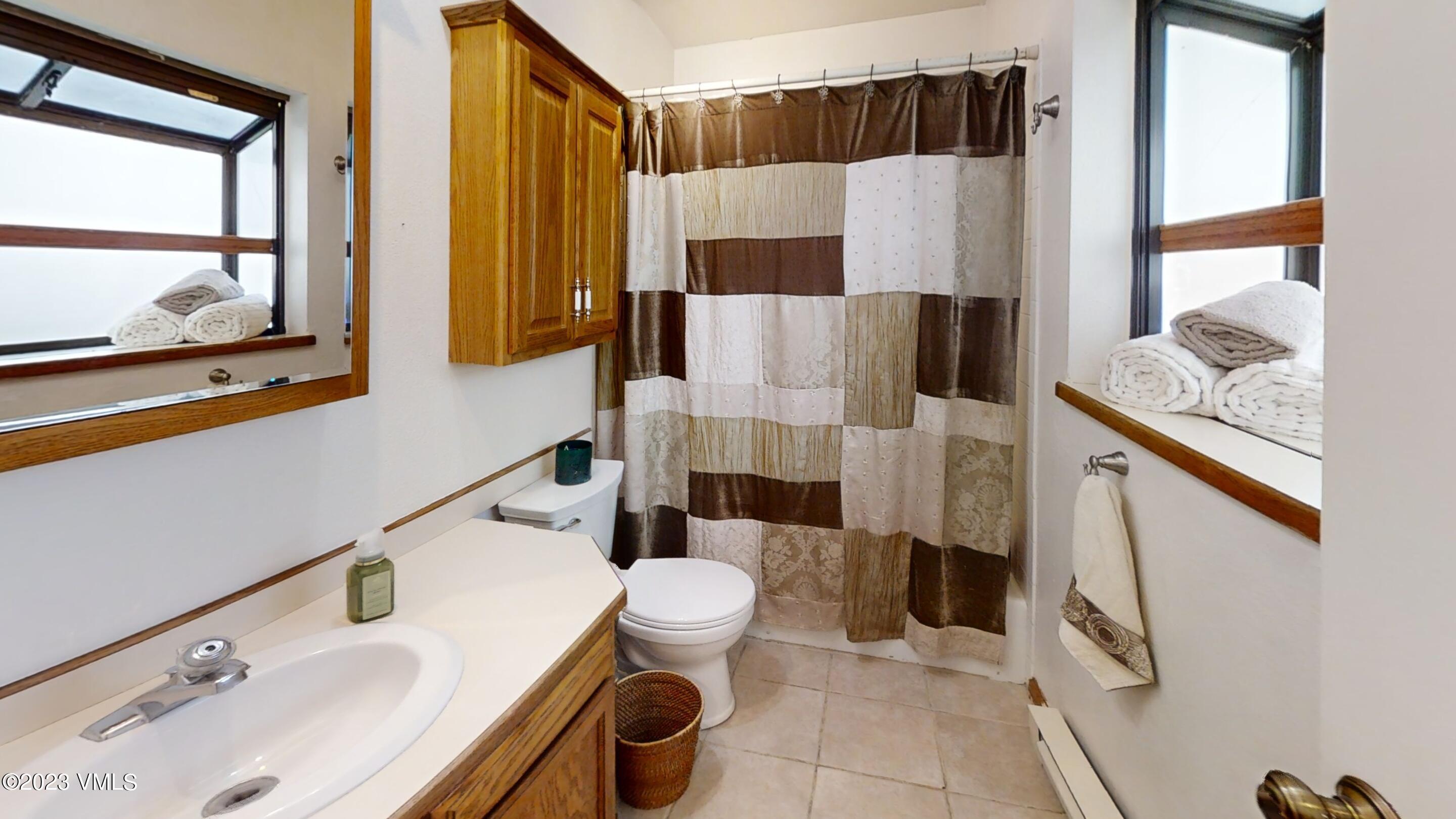 945 Red Sandstone Road, Unit B3 Vail, CO 81657 - Photo 23 of 48 a bathroom with a sink and toilet