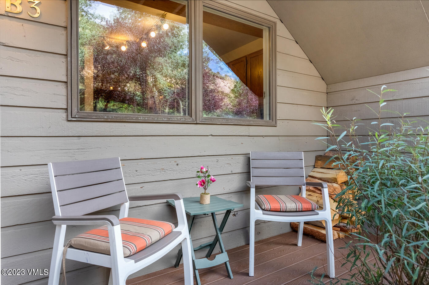 945 Red Sandstone Road, Unit B3 Vail, CO 81657 - Photo 32 of 48 a backyard of a house with wooden floor and outdoor seating
