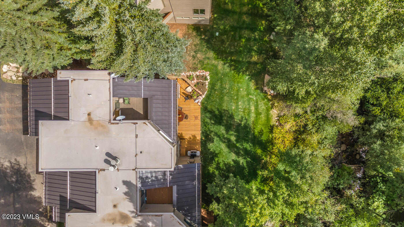 945 Red Sandstone Road, Unit B3 Vail, CO 81657 - Photo 44 of 48 an aerial view of a house with a yard and large tree
