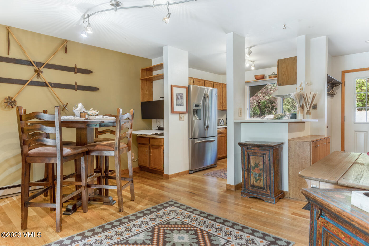 945 Red Sandstone Road, Unit B3 Vail, CO 81657 - Photo 7 of 48 a kitchen with stainless steel appliances kitchen island granite countertop a refrigerator and microwave