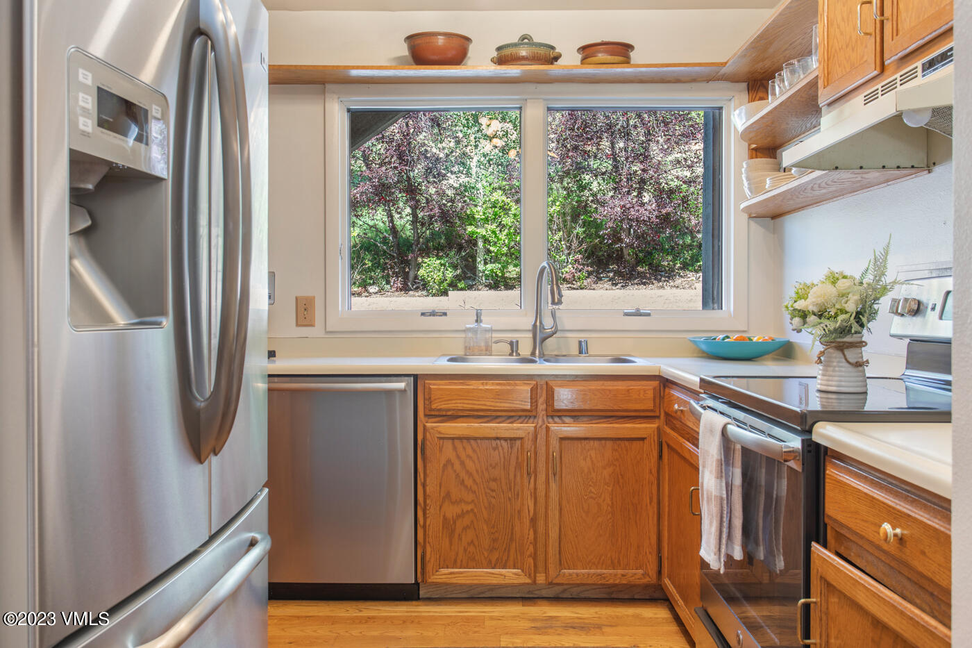 945 Red Sandstone Road, Unit B3 Vail, CO 81657 - Photo 8 of 48 a kitchen with stainless steel appliances granite countertop a refrigerator and a sink