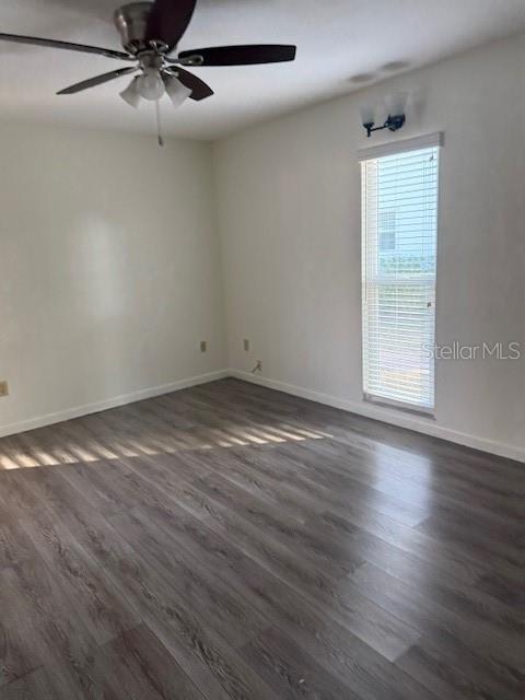 2935 Plantation Road Winter Haven, FL 33884 - Photo 12 of 32 an empty room with wooden floor fan and windows