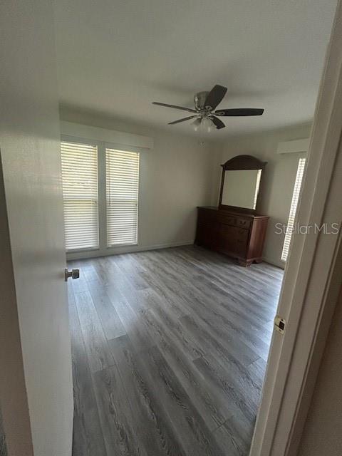 2935 Plantation Road Winter Haven, FL 33884 - Photo 13 of 32 wooden floor in an empty room with a window