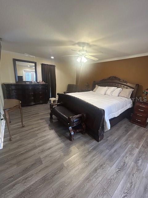 2935 Plantation Road Winter Haven, FL 33884 - Photo 18 of 32 a bedroom with a bed and wooden floor