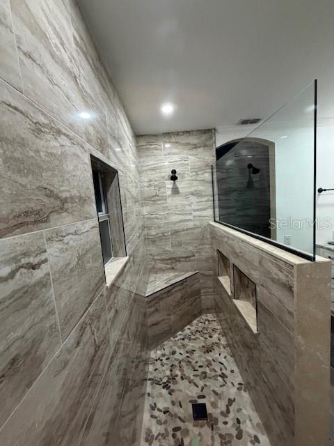 2935 Plantation Road Winter Haven, FL 33884 - Photo 23 of 32 a bathroom with a shower and a mirror