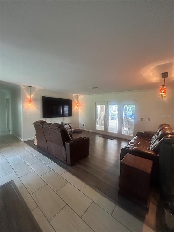 2935 Plantation Road Winter Haven, FL 33884 - Photo 3 of 32 a living room with furniture and a flat screen tv
