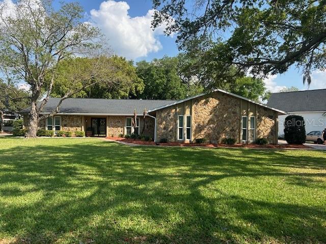 2935 Plantation Road Winter Haven, FL 33884 - Photo 32 of 32 a front view of a house with a garden