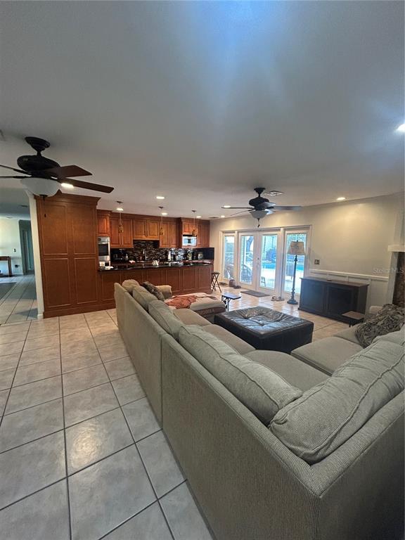 2935 Plantation Road Winter Haven, FL 33884 - Photo 9 of 32 a living room with furniture and kitchen view