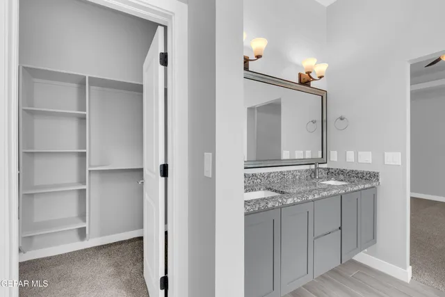 a view of hallway with wooden floor