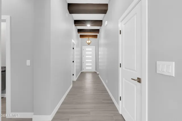 a kitchen with stainless steel appliances granite countertop a stove and a wooden floors
