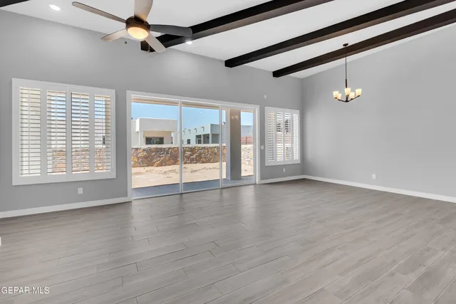 a bathroom with a granite countertop toilet sink and mirror